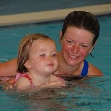 Parent and baby in a swimming pool